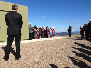 MetService Chief Executive Peter Lennox looks on as local school children sing at the opening ceremony.